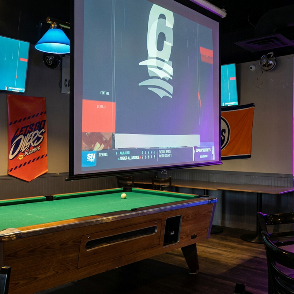 Sports bar interior with pool table, Edmonton Oilers banners, large hockey screens, arcade game, and neon purple lighting.